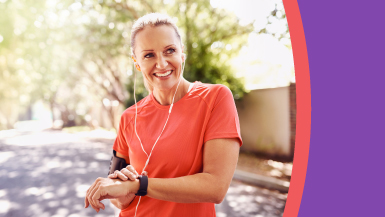 Smiling women checks her pulse during exercise.