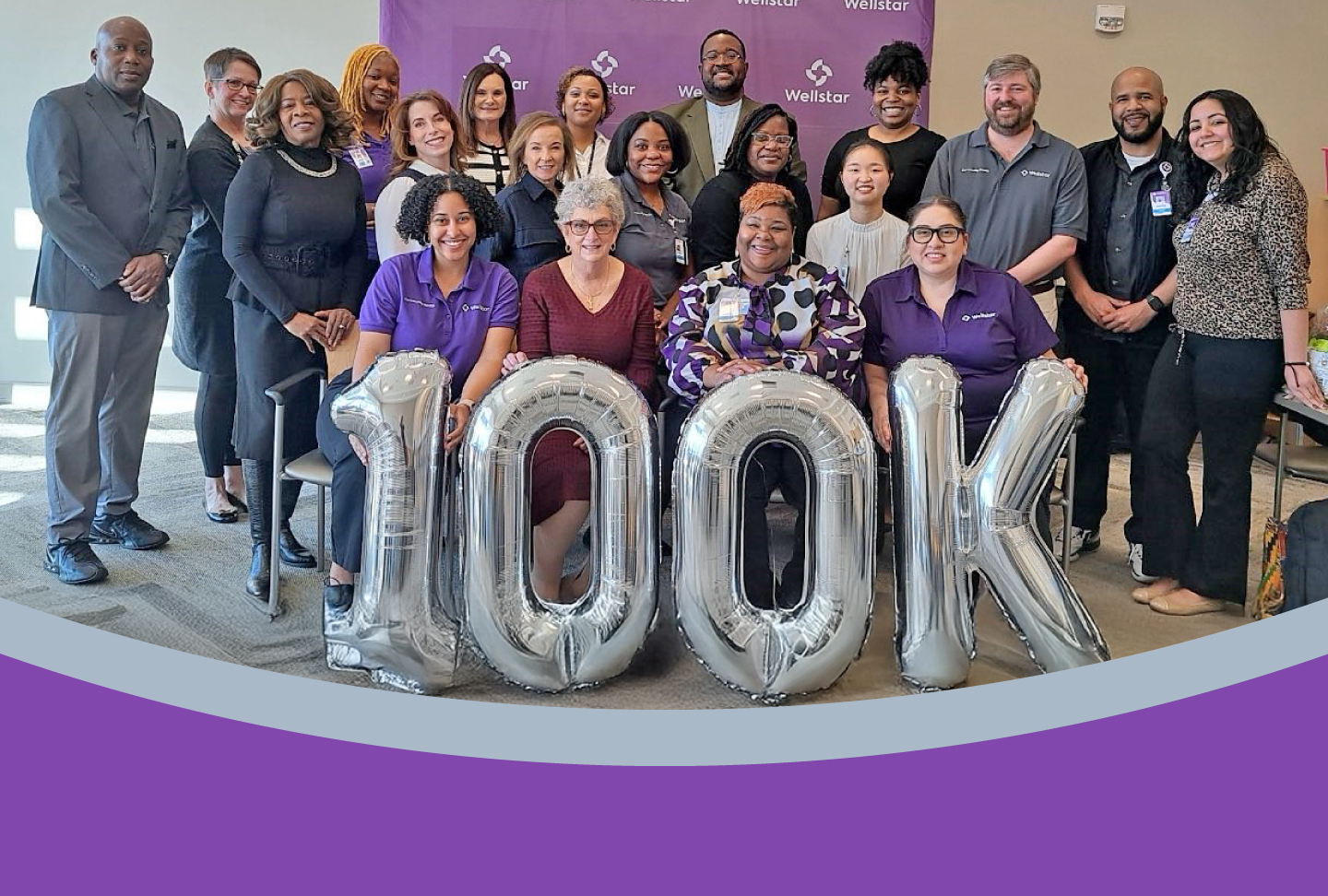 Wellstar Delivers PeopleCare to our Communities Photo of team with balloons reading "100K"