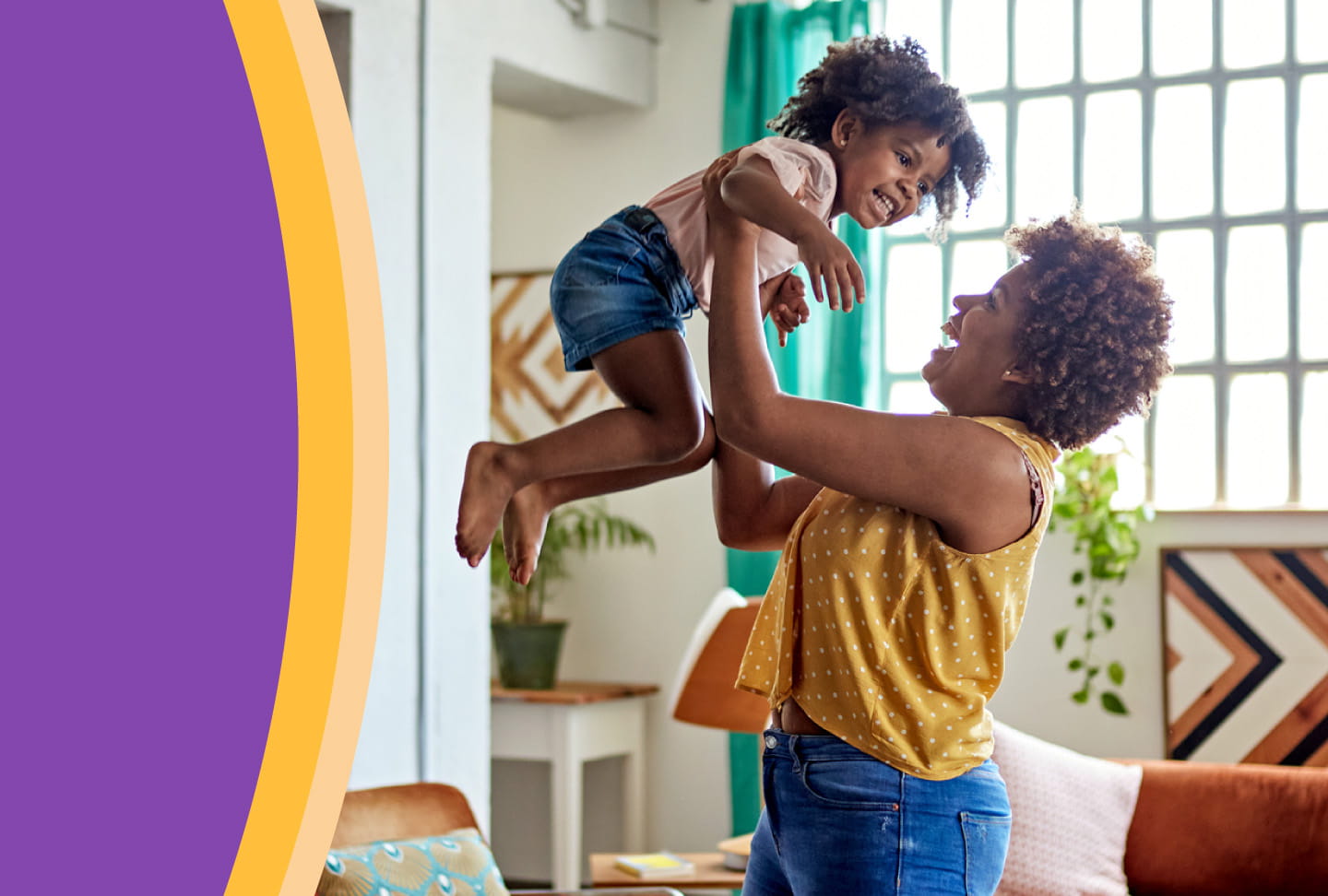 Break Free from Uterine Fibroid Pain Mother smiling and lifting child up in the air.