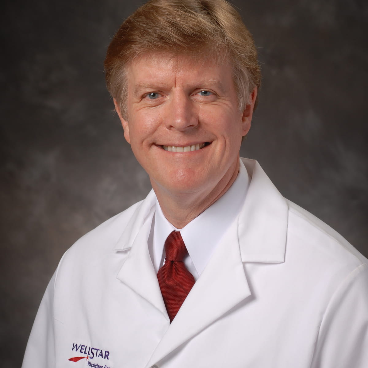 A friendly headshot of Larry Clements, MD