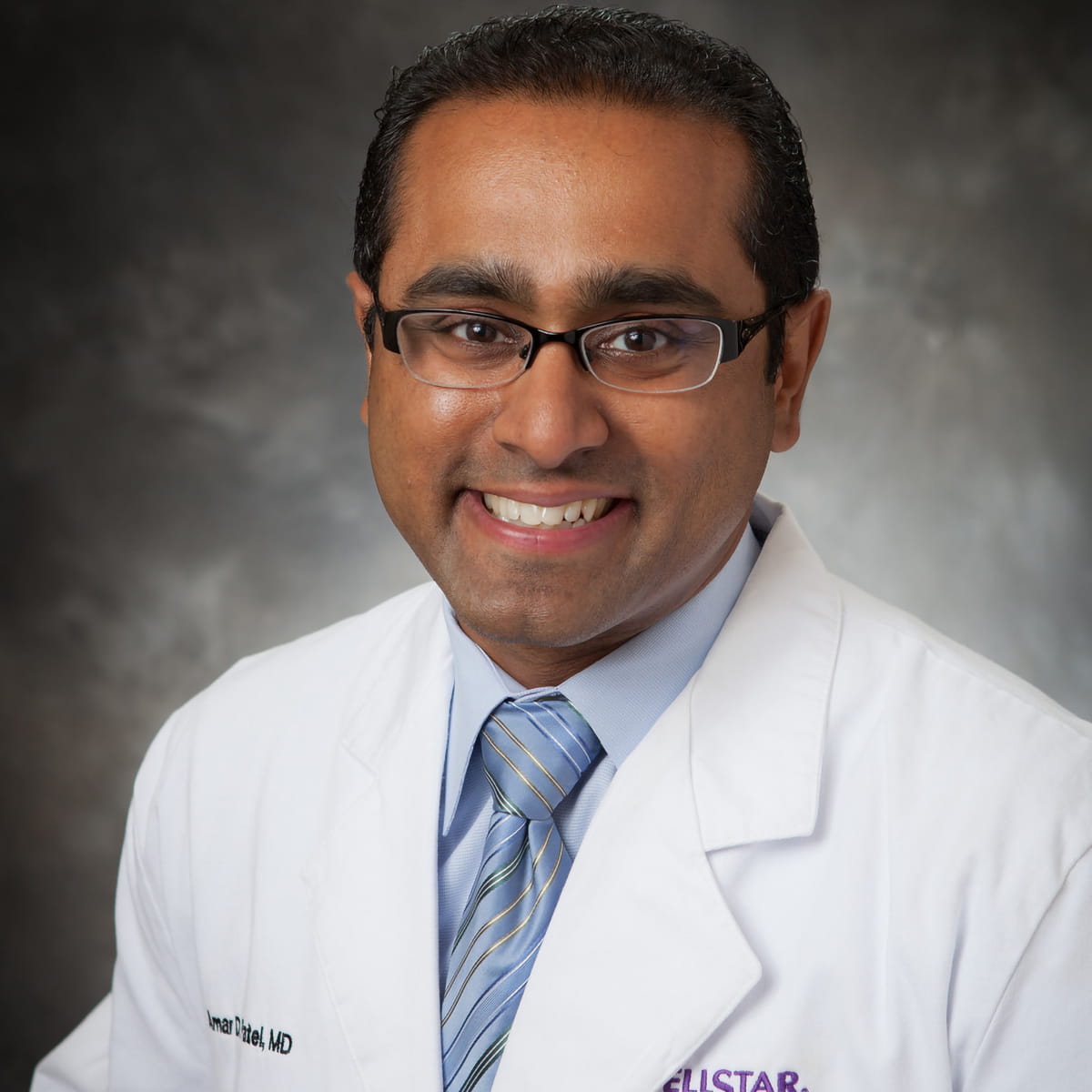 A friendly headshot of Amar Patel, MD