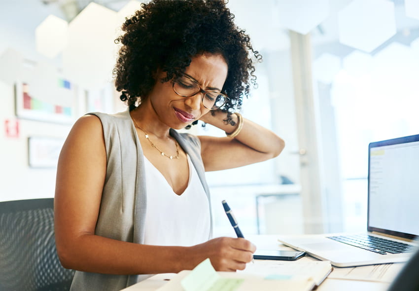 Woman at Desk with Neck Pain