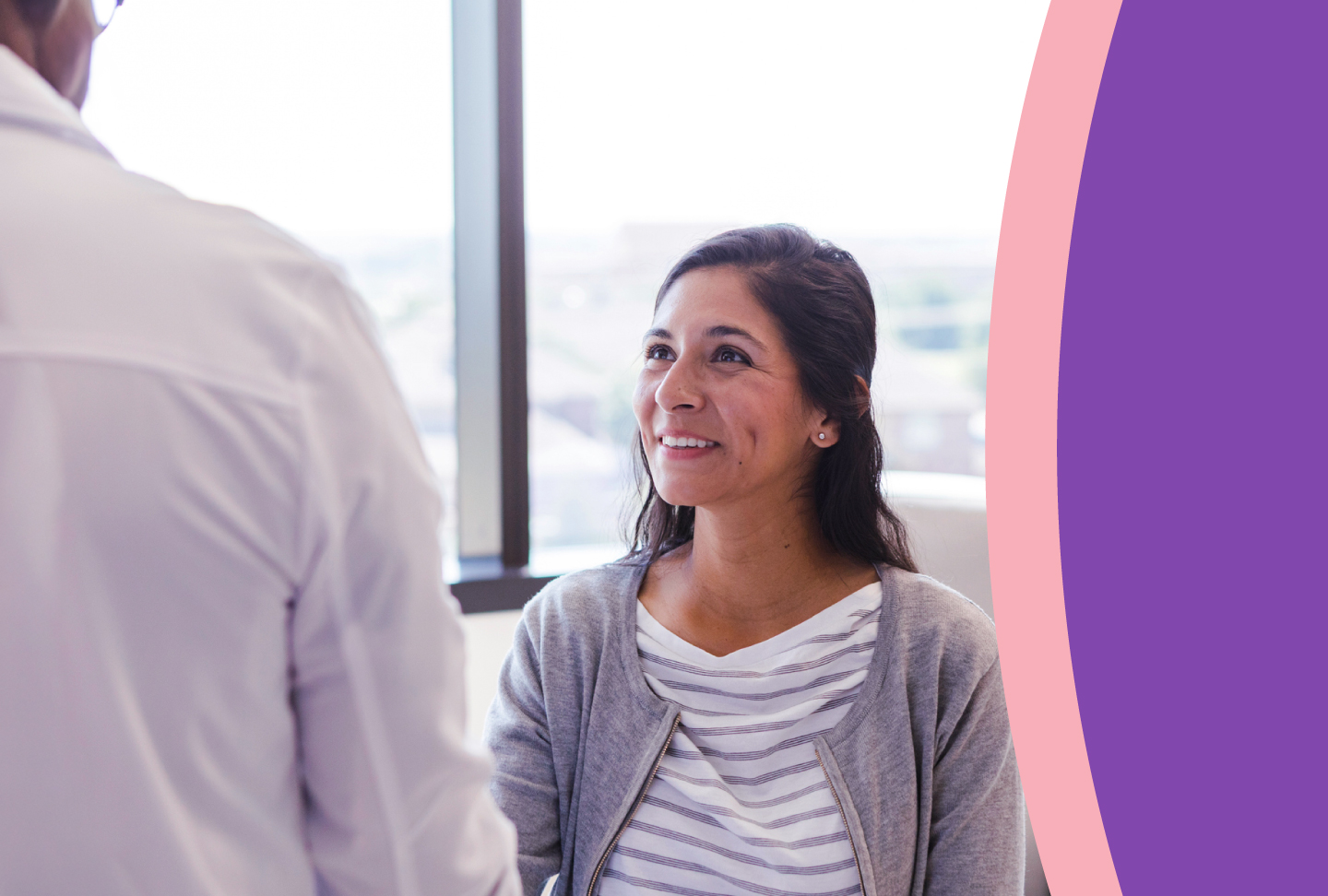 A patient looks encouraged during a discussion with her healthcare provider
