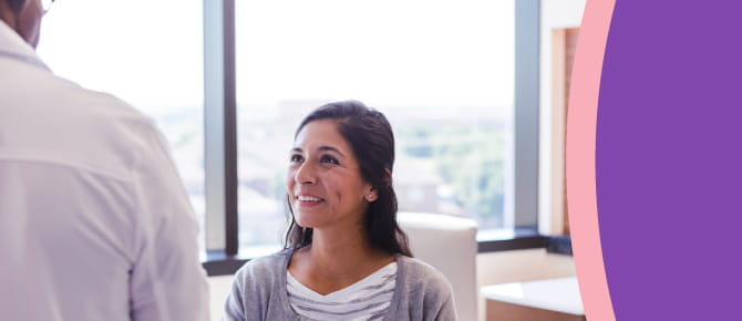 A patient looks encouraged during a discussion with her healthcare provider