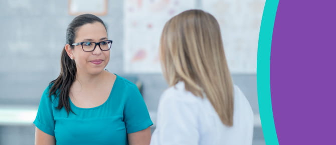 A healthcare provider consults with her patient