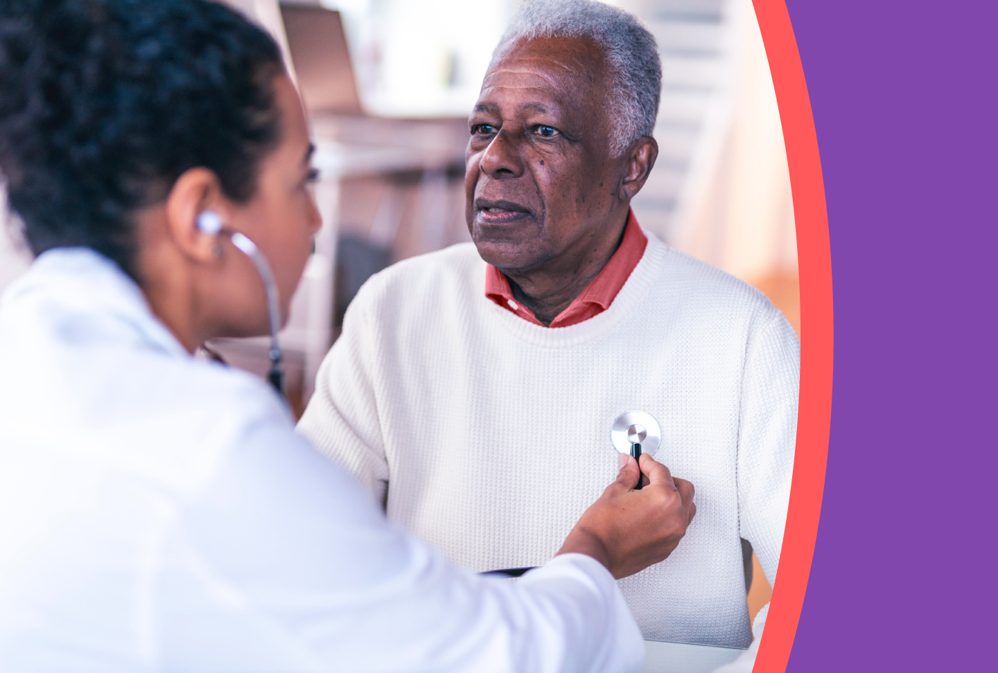 Healthcare provider listens to her patient's heart using a stethoscope