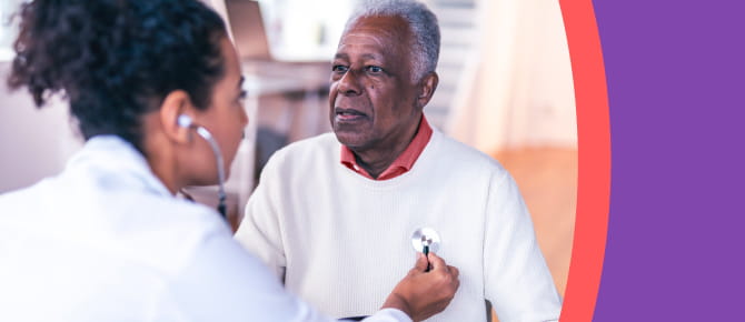 Healthcare provider listens to her patient's heart using a stethoscope