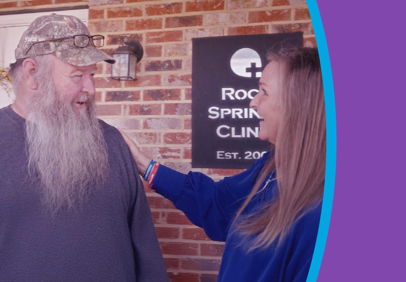 Two smiling people share a friendly conversation