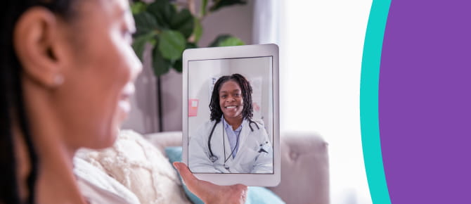 Person speaking with doctor during virtual visit on tablet
