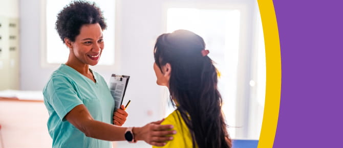 A healthcare provider gently reassures her patient