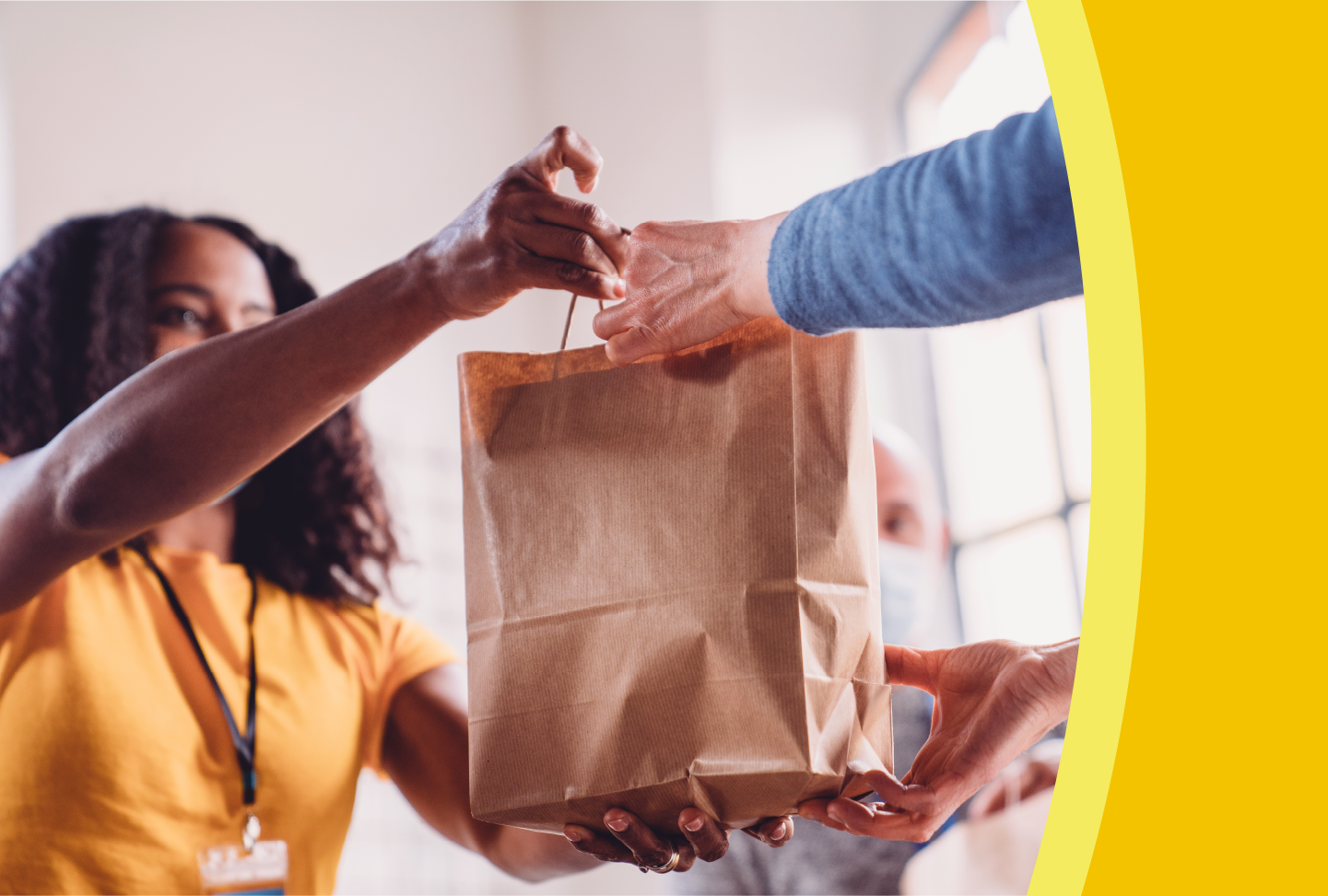 Wellstar Partners with Feeding the Valley to Improve Food Access and Nutrition Person receiving bag of groceries
