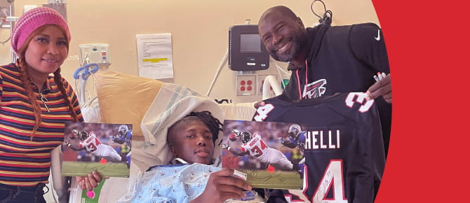A Wellstar patient is visited by a football player