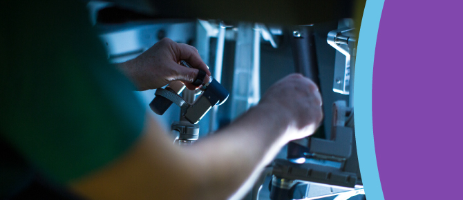 A healthcare provider works with the Da Vinci 5 robot