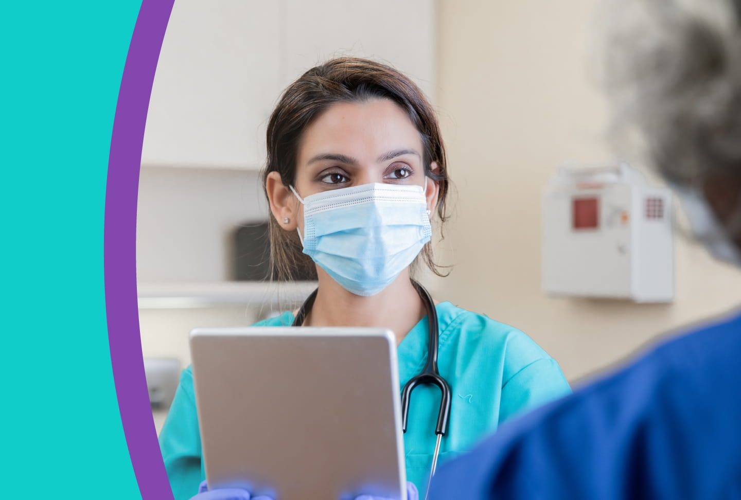 Provider speaking with patient while looking at patient's chart