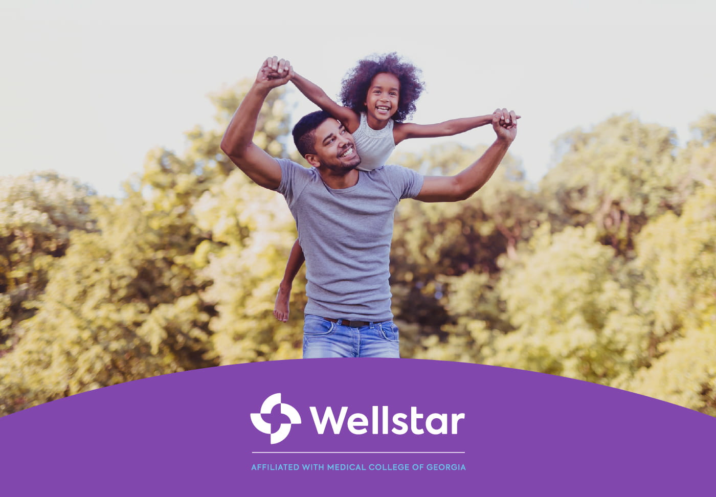 Parent with child on shoulders. Wellstar, affiliated with Medical College of Georgia logo