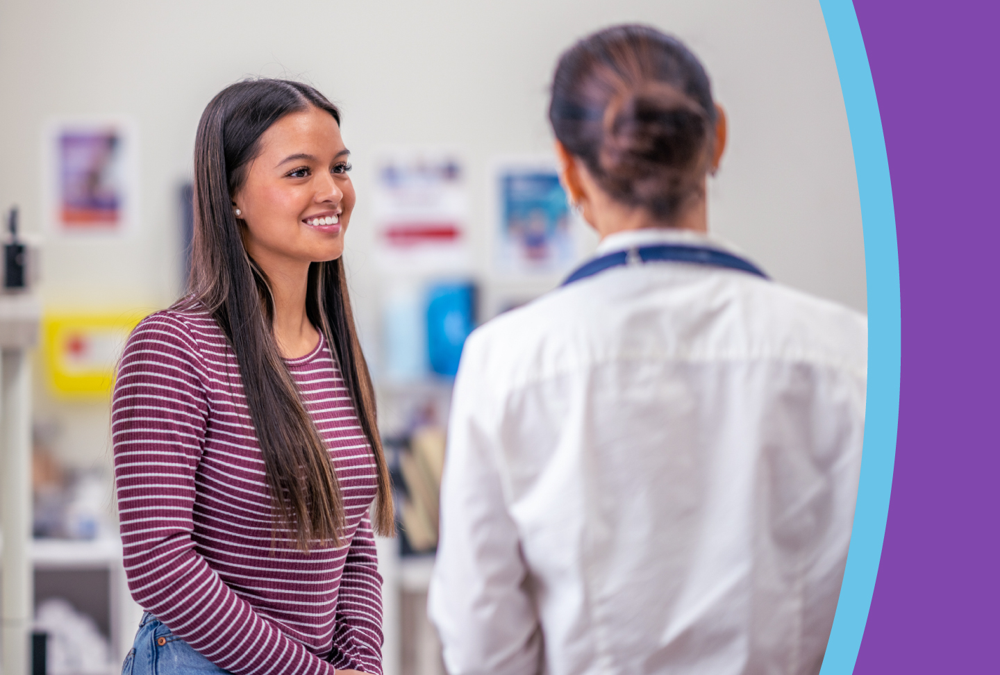 Healthcare provider consults with her young adult patient