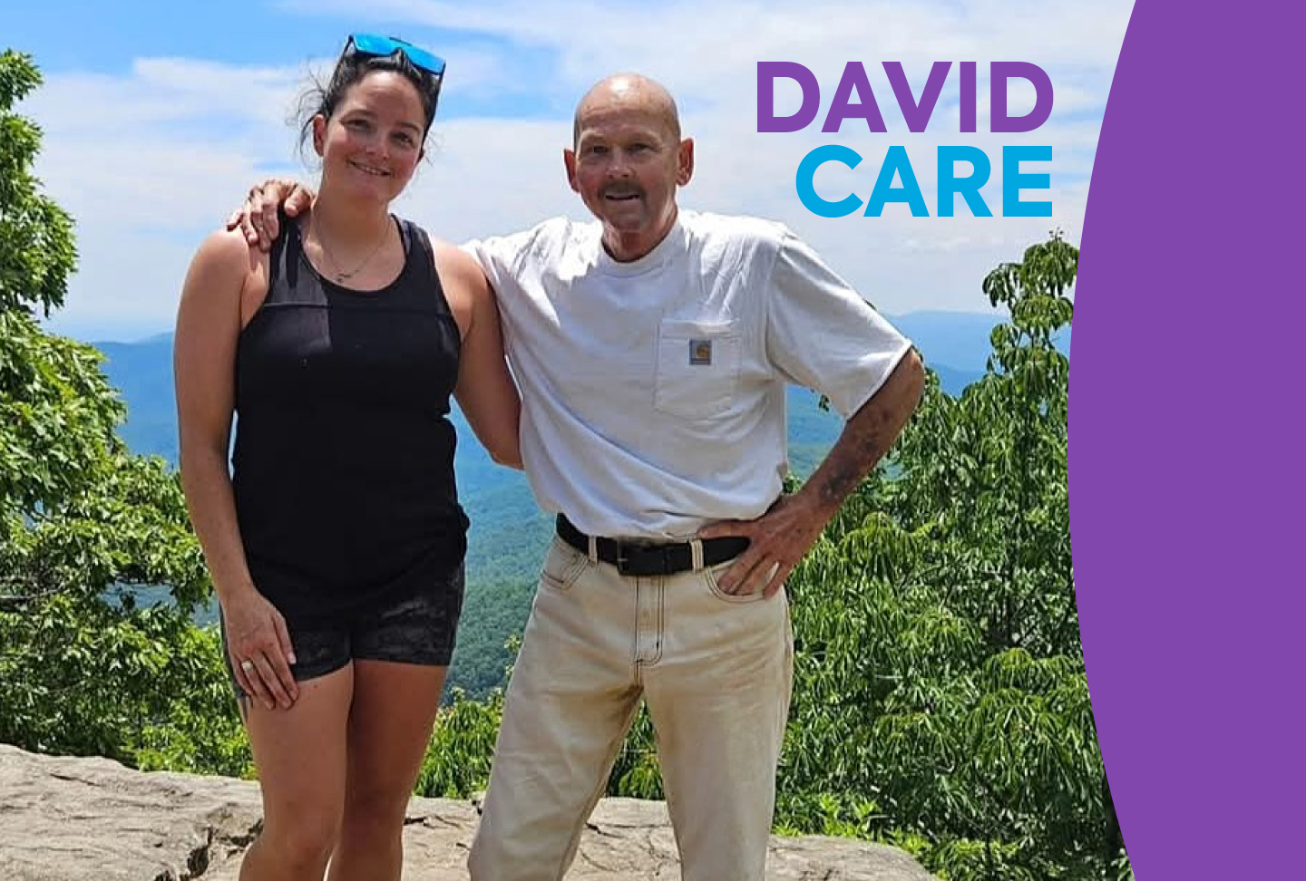 David Butler and his daughter stand triumphantly at Preacher's Rock, the summit of Blood Mountain in North Georgia. The vista of the Blue Ridge Mountains spans the horizon behind them.