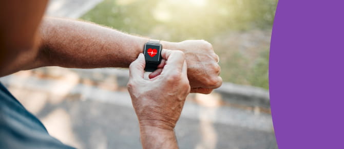 Person looking at heart rate on smart watch.
