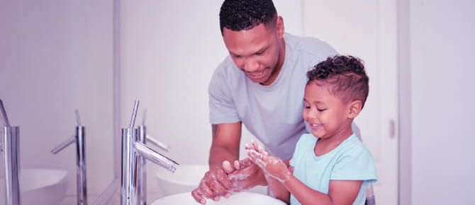 Parent and child washing hands