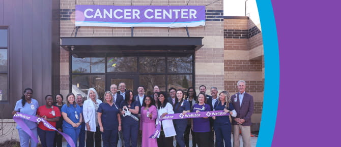Attendees celebrate at the ribbon-cutting ceremony at Wellstar Spalding Cancer Center