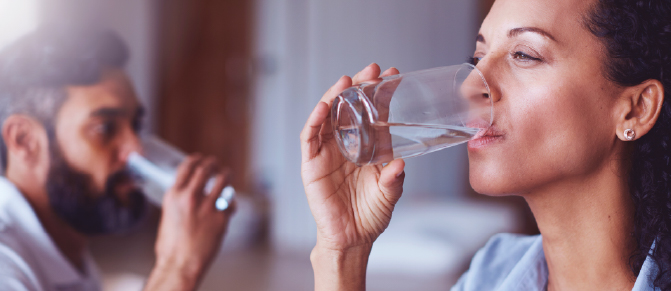 Woman and man drinking water