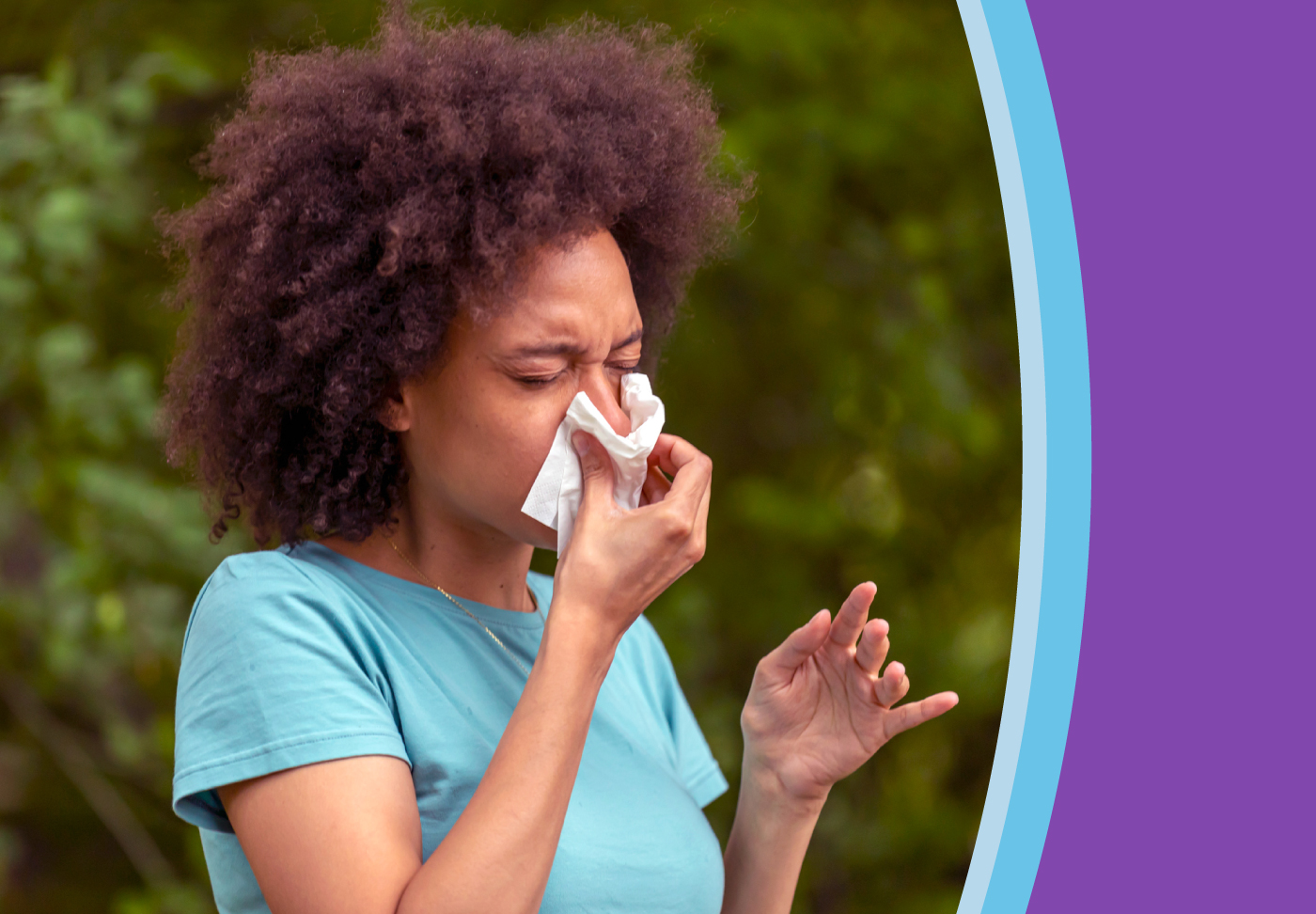 An allergy sufferer blows her nose