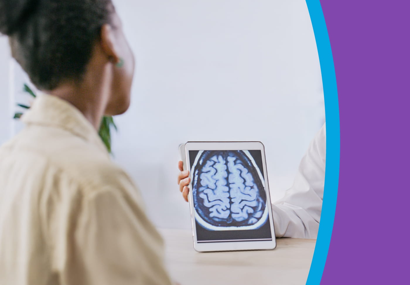 A healthcare provider shows a brain scan to their patient