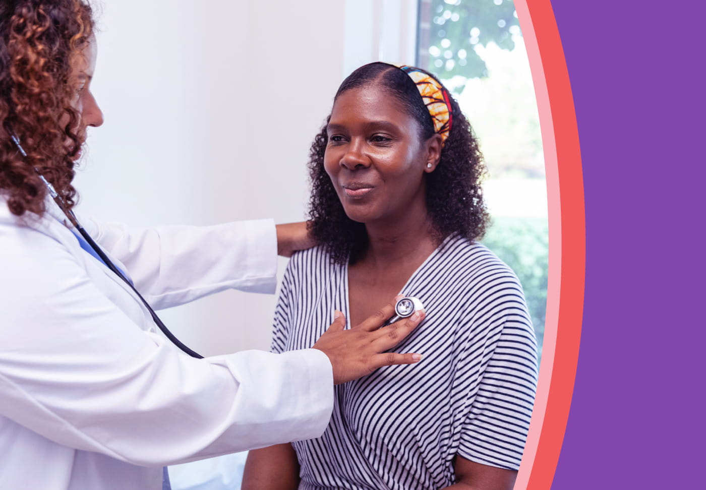 A healthcare provider listens to her patient's heartbeat.