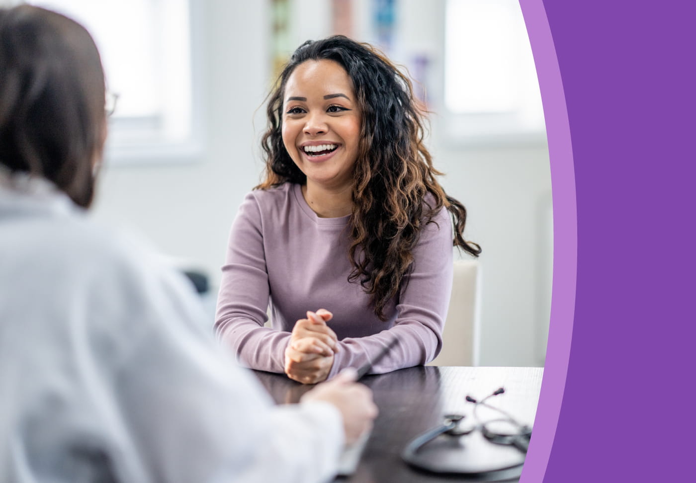 Healthcare provider consults with a smiling patient