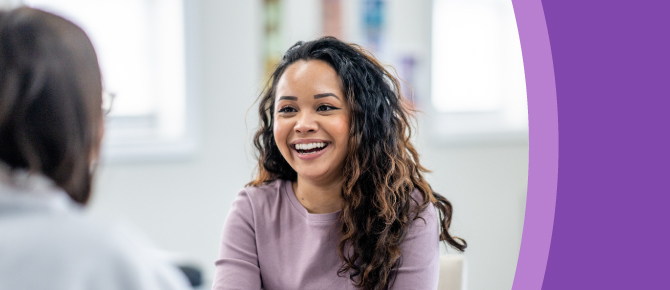 Healthcare provider consults with a smiling patient