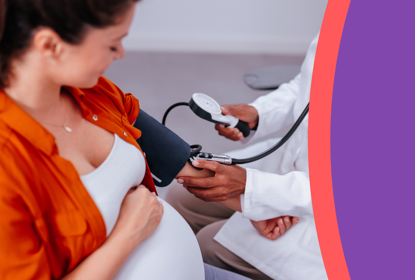 Healthcare provider checks the blood pressure of pregnant patient