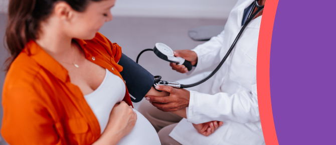 Healthcare provider checks the blood pressure of pregnant patient