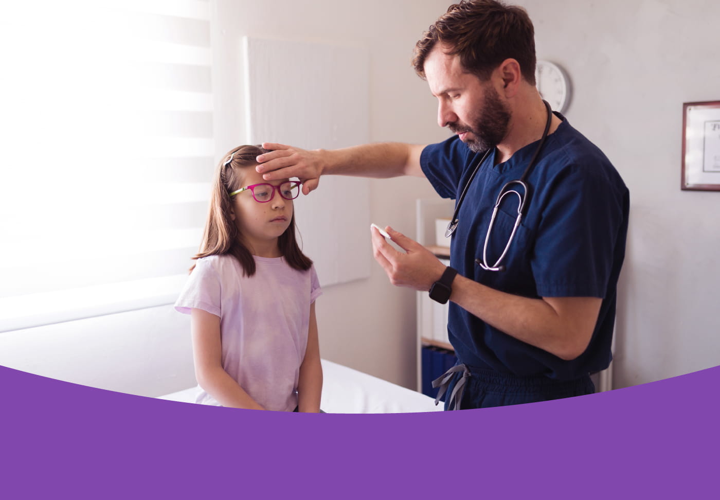 Healthcare provider checks girl's temperature