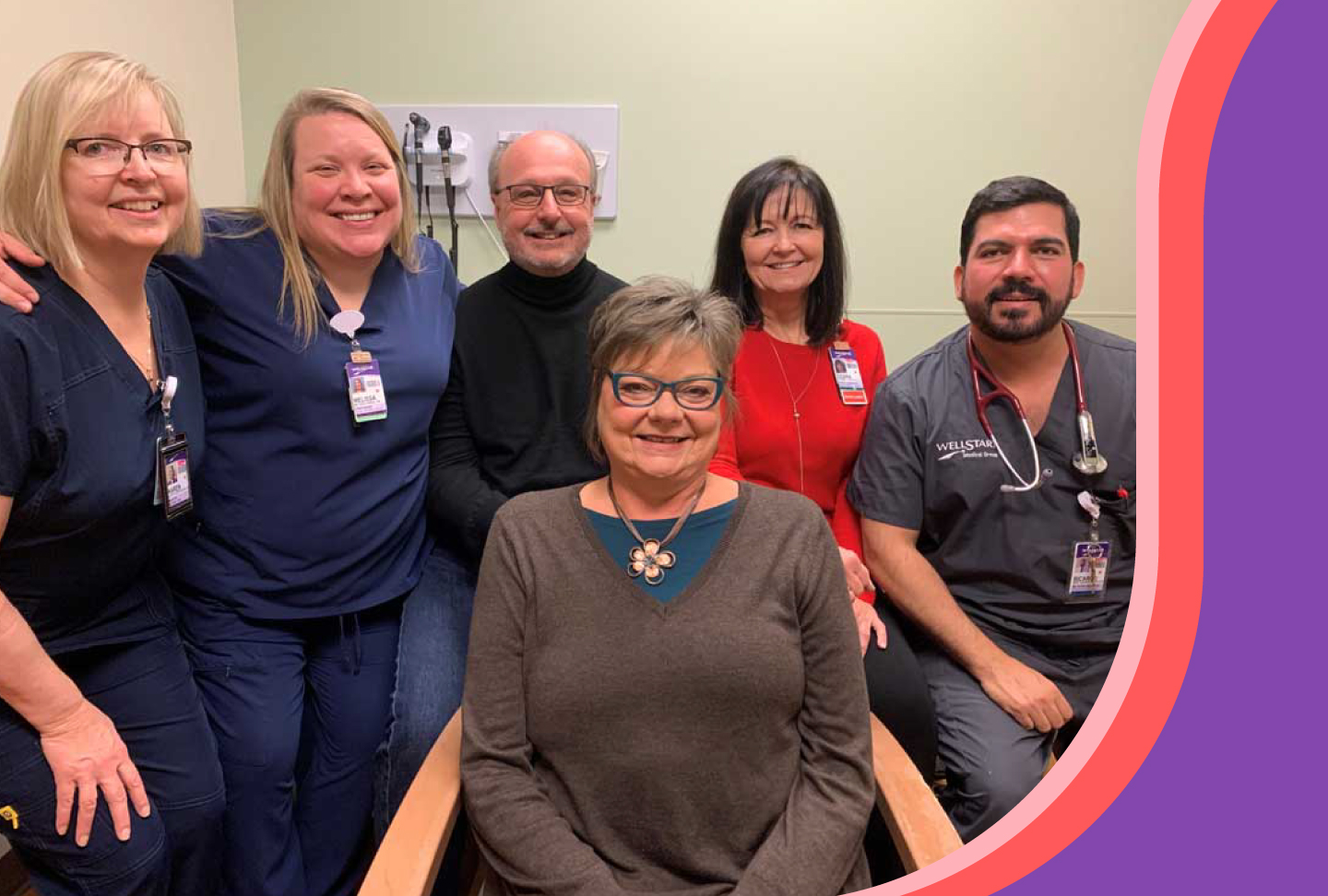 Heidi Bohlmann (front center) stands with her husband and care team at a medical office.