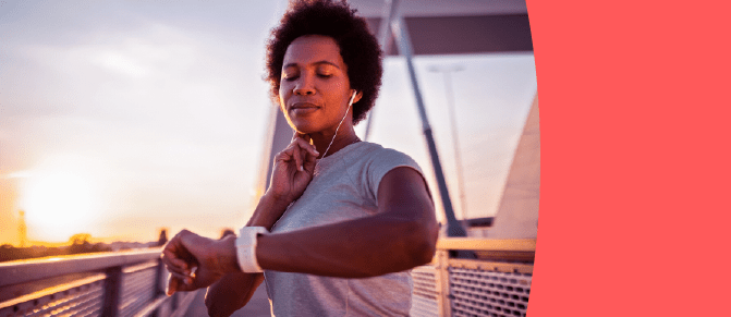 Person looking at watch and checking pulse