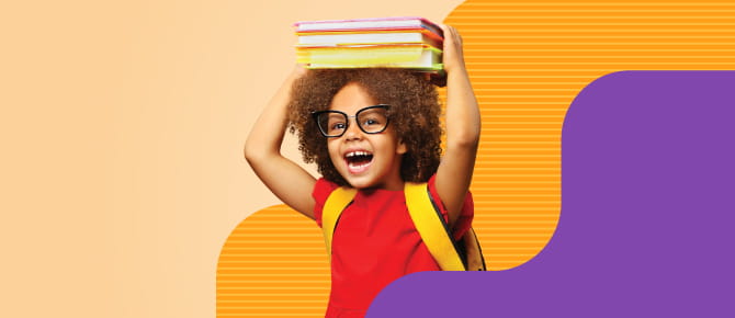Child carrying backpack, holding books above head
