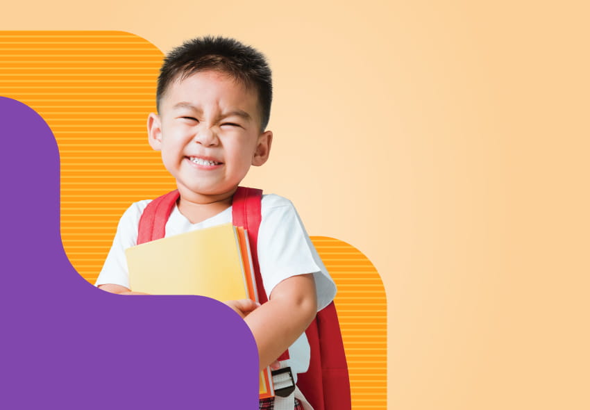 Smiling child with backpack and notebooks