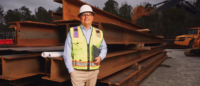 Brett standing in front of worksite