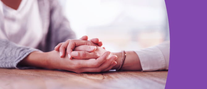 Two people holding hands