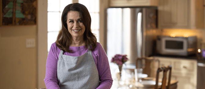 Cindy smiling in the kitchen