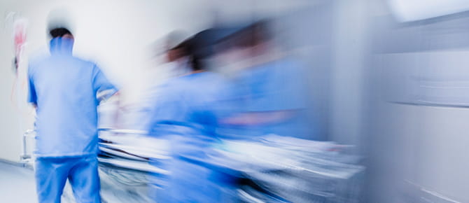 Three emergency care physicians wearing PPE