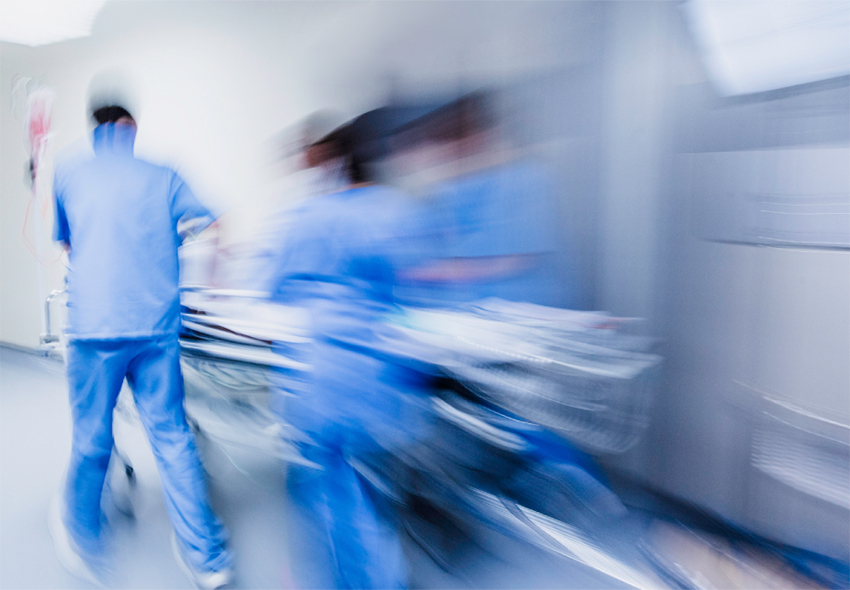 Emergency Care During COVID-19 Three emergency care physicians wearing PPE