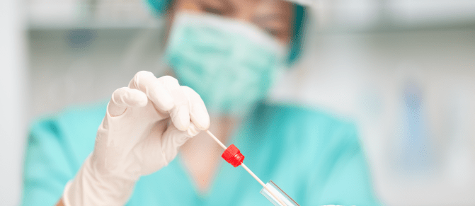 Nurse checking a COVID test swab