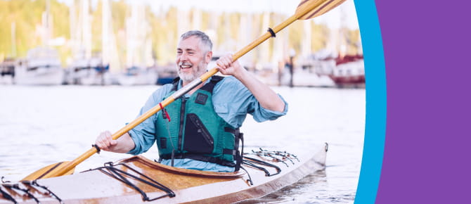 Smiling man in kayak