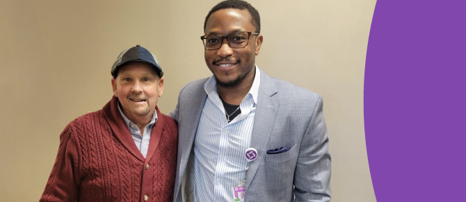 David Butler stands, smiling, with Dr. Fiyin Sokoya, a dual board-certified head and neck cancer specialist and facial plastic surgeon at Wellstar.
