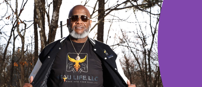 Eric Janeau stands tall and proud showing off his Neau Life t-shirt. The word "Neau" is a double play on words: his last name and his second chance at life after his Wellstar doctors helped him overcome cancer and a host of conditions caused by excess weight. Neau Life is the name of his cancer support group and podcast. 