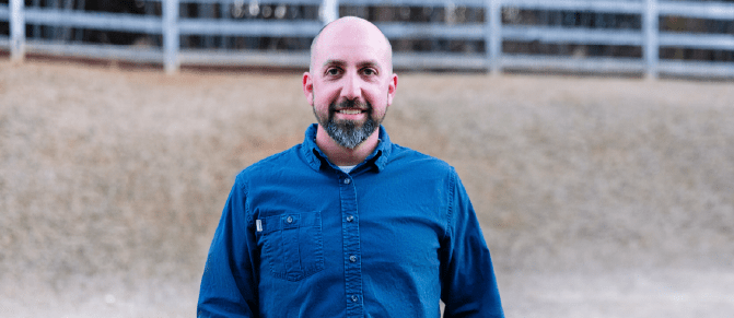 Photo of Scott Hullihen outdoors smiling.