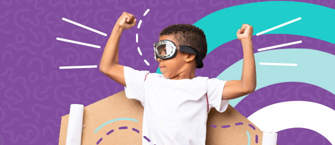 Child flexing arms and posing as a superhero.