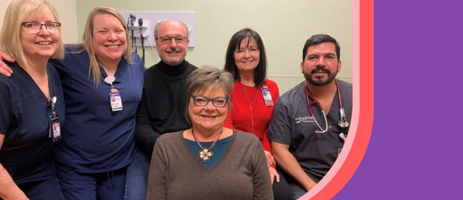Heidi Bohlmann (front center), with her husband Steve (back center), and Wound Care Center caregivers, from left, Karen Johnstone, RN, CWON; Melissa Conrad, RN; Debra Gonzalez, RN; and Ricardo Duran, MD.