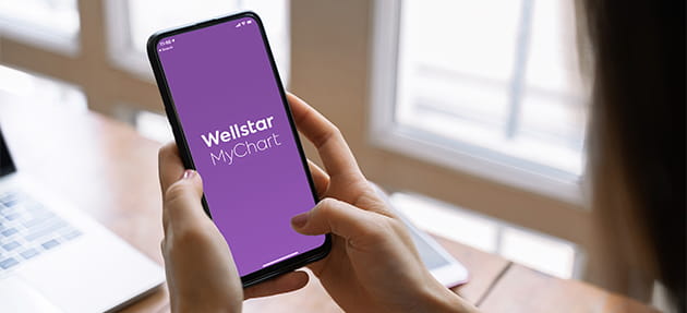 User on mobile device accessing Wellstar MyChart
